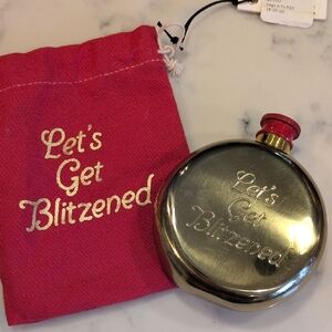 Gold Flask with Red Cap